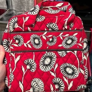 Vera Bradley organizer (approx 7x8”) w/ mesh pouches, straps inside. Zips closed